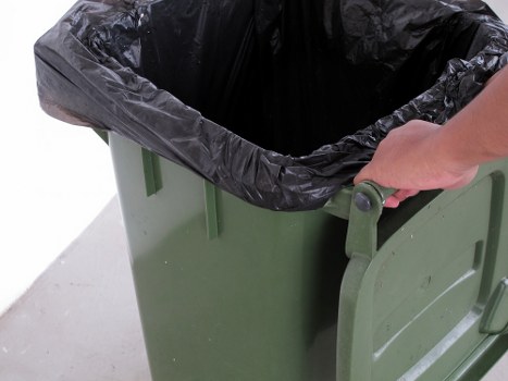 Various types of business waste materials ready for disposal
